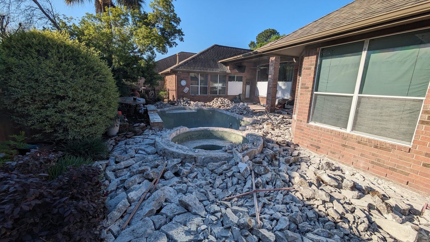 Full demolition of old pool deck, concrete jackhammered to rubble